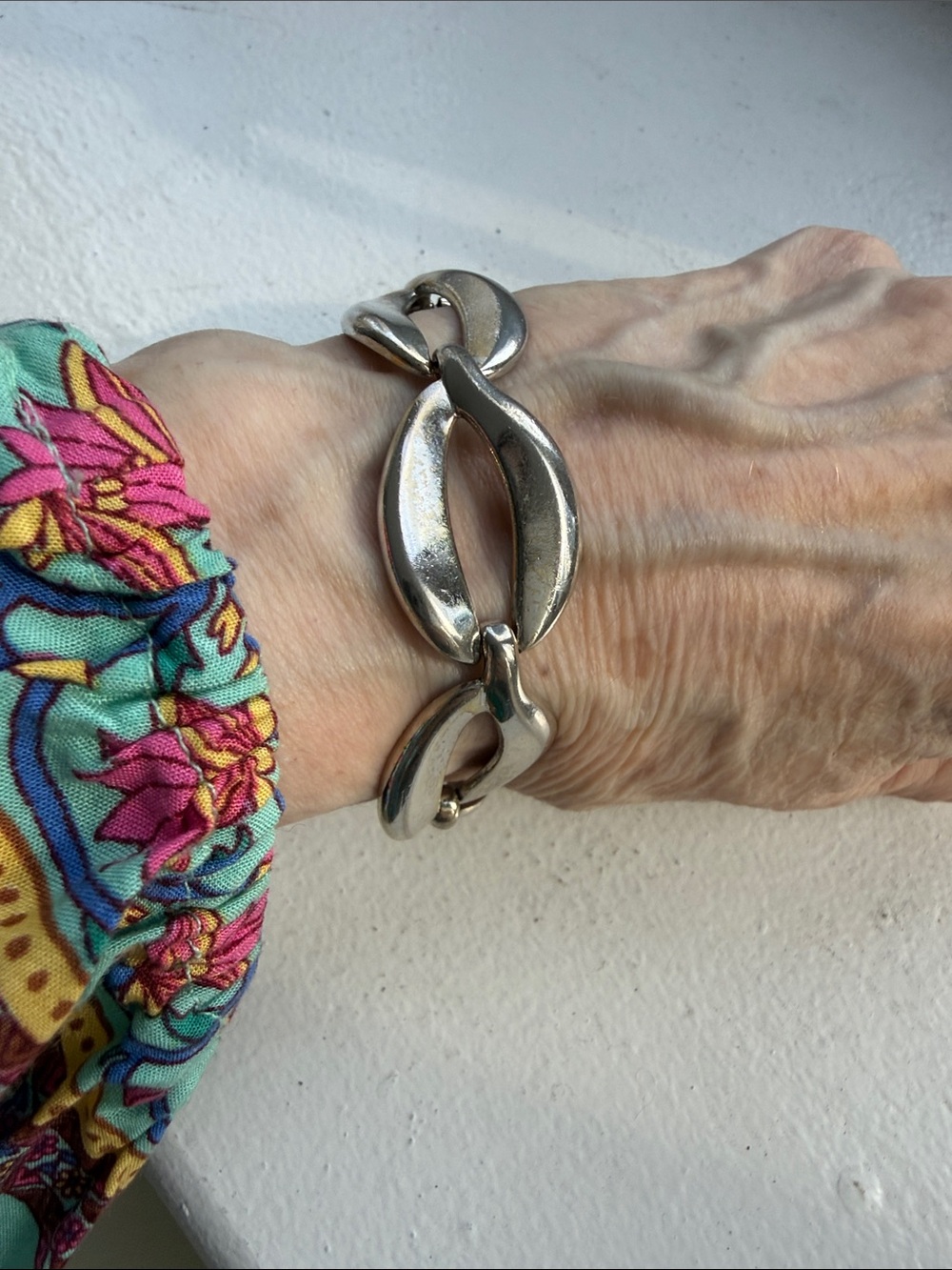 Vintage Monet Silver Tone Open Center Curved Link Bracelet with Safety Chain.
